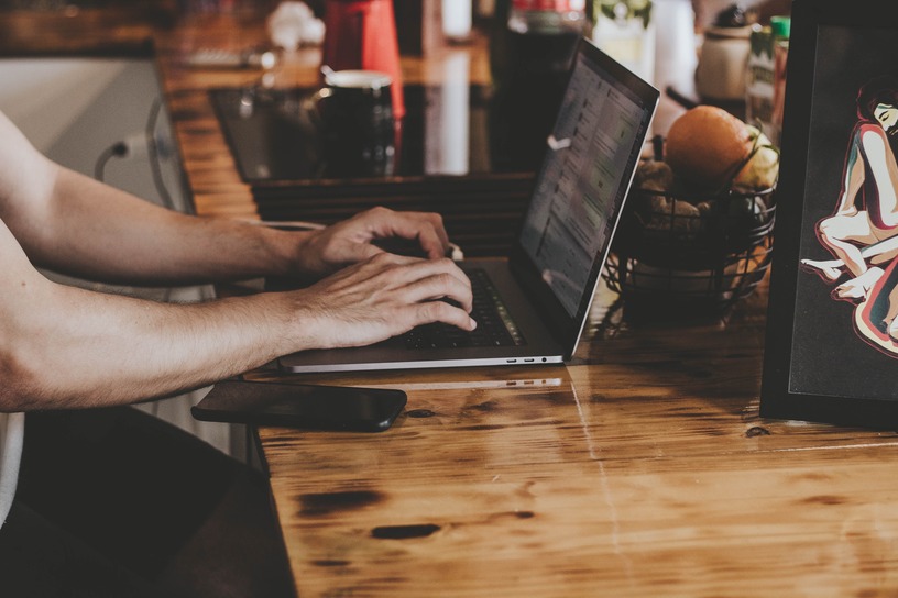 Picture of person using laptop.